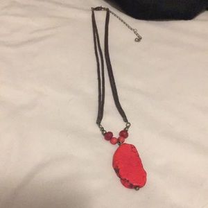 Red stone look necklace on brown chord